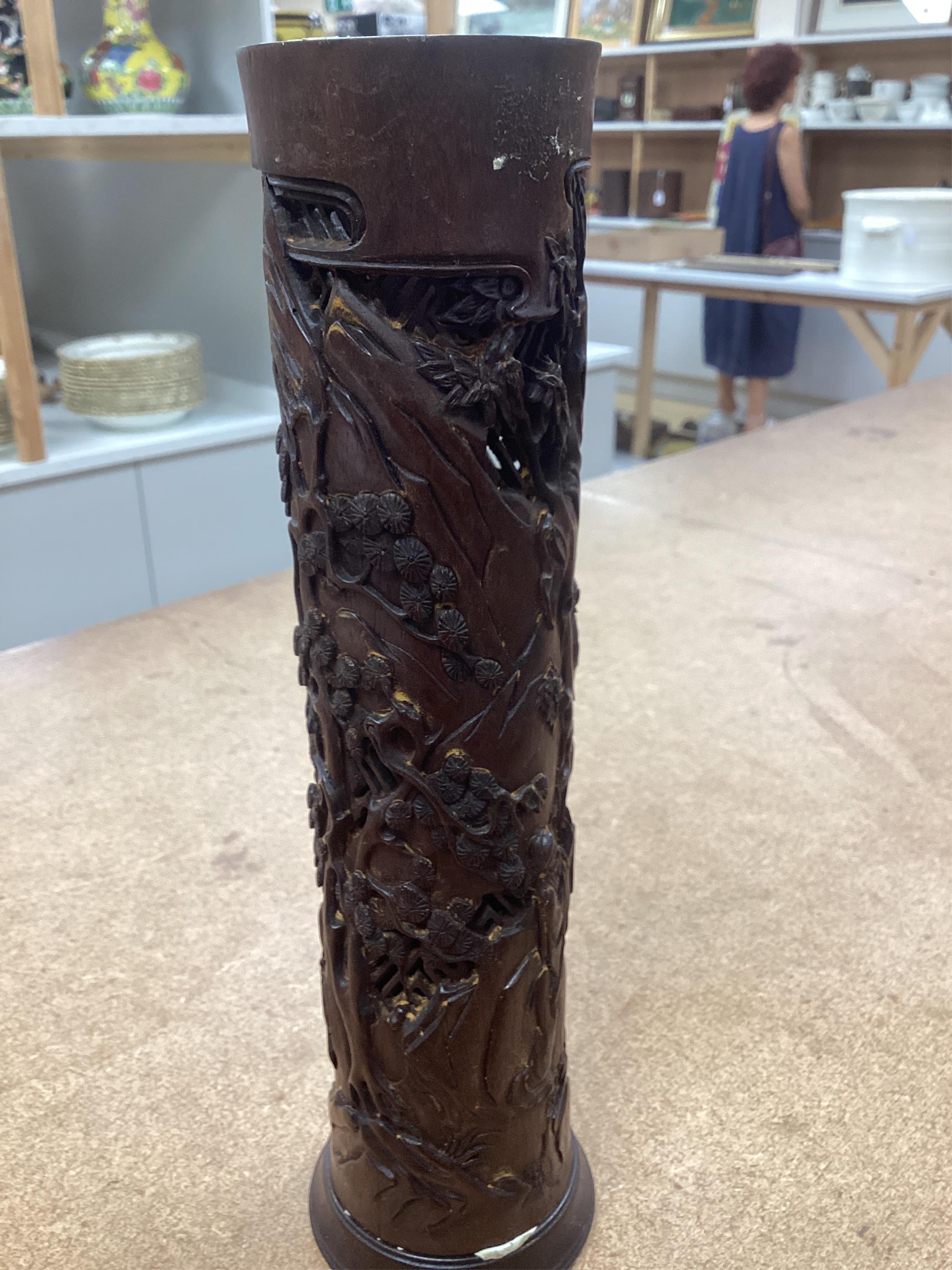 A pair of Chinese hardwood incense holders carved with trees and figures, cased, 29cm high. Condition - good